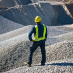miner looks out over a field of common construction aggregates